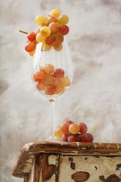 Bunch of pink grapes over rustic background Stock Photos