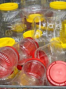 A bunch of plastic cans with colourful lids Stock Photos
