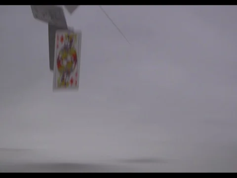 A bunch of playing cards bulking up in at the left side of shot, slow motion Stock Footage 74107514