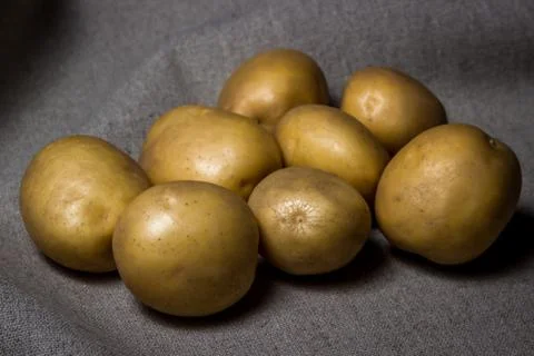 A bunch of potatoes on a sacking.  Stock Photos