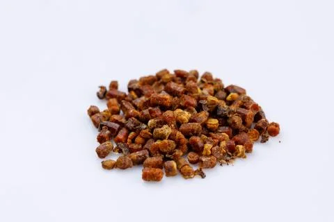 A bunch of propolis on a white background. Bee product. Close-up. Stock Photos