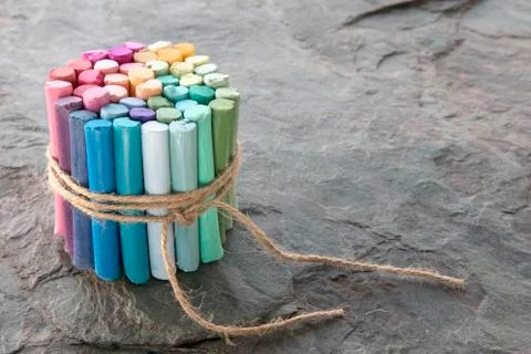 Bunch of rainbow colored pastel crayons Stock Photos
