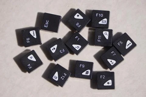 Bunch of random keys on computer keyboard. disassembled keyboard. Top view of Stock Photos