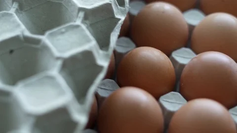 Bunch of raw chicken eggs in carton box Stock Footage 127432450