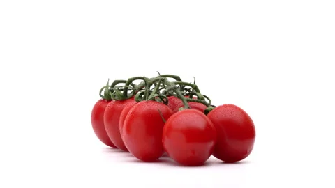 Bunch of red cherry tomatoes on a branch rotating on white background. Stock Footage 157091929