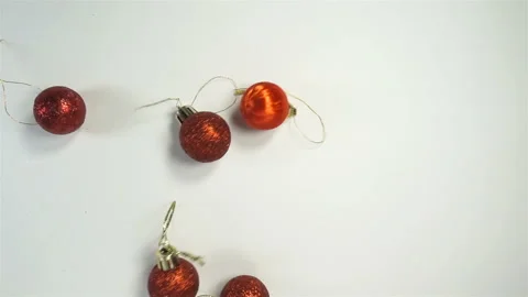 A bunch of red christmas balls falling in slow motion Video stock 143426082