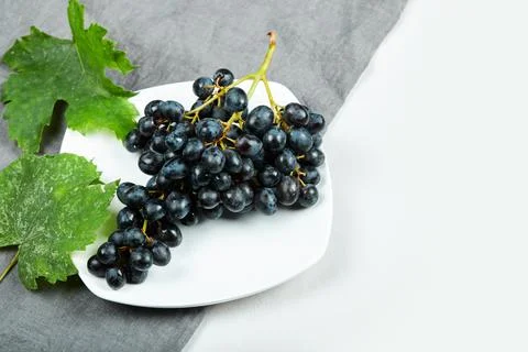 A bunch of red grapes on white background Stock Photos