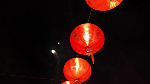 A bunch of red lanterns are lit up in the sky Видео 315681473