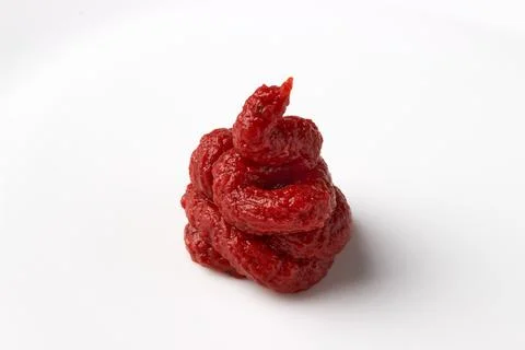 A bunch of red tomato ketchup paste isolated on a white background Foto stock