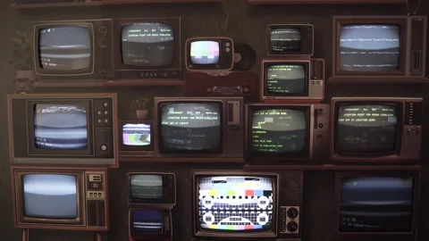 A bunch of retro TVs from the 80s and 90s working at the same time, wall design. Stock Footage 247470786