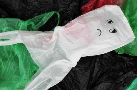 A bunch of reusable, multi-colored plastic bags polluting the environment. Foto stock