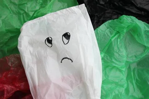 A bunch of reusable, multi-colored plastic bags polluting the environment. Foto stock