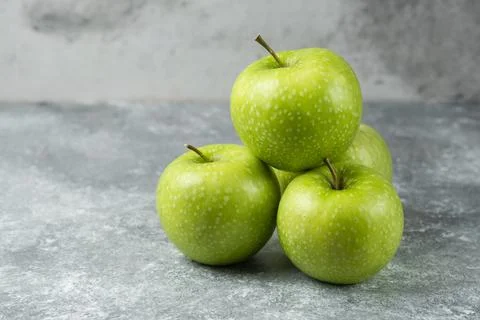 Bunch of ripe apples on marble background Stock Photos