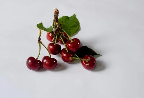 Bunch of ripe cherries on a white table. Diet food concept. Foto stock