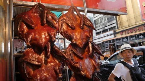 A Bunch of Roasted Golden Ducks Hang in Restaraunt in Chinatown. Bangkok 스톡 동영상 87984581