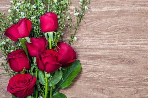 A bunch of roses on a wood pattern background Stock Photos