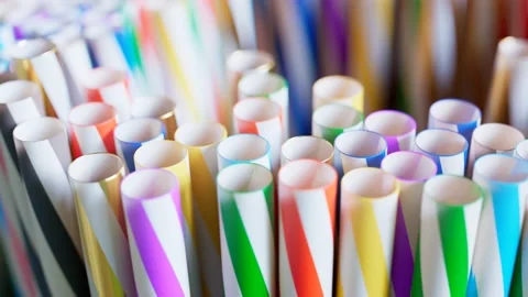 Bunch of rotating drinking straws. A large number of colourful straws on a bar. Stock Footage 133470584