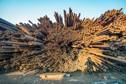 Bunch of rust pipes is made one by one Stock Photos