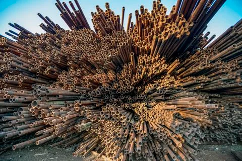 Bunch of rust pipes is made one by one Stock Photos