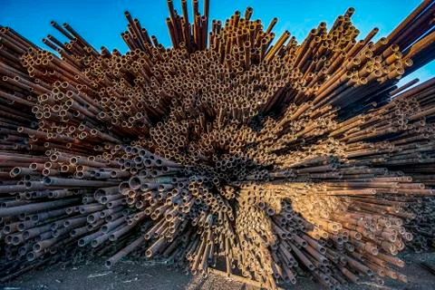 Bunch of rust pipes is made one by one Foto stock