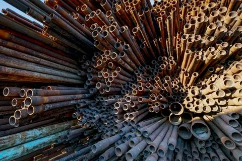 Bunch of rust pipes is made one by one Stock Photos