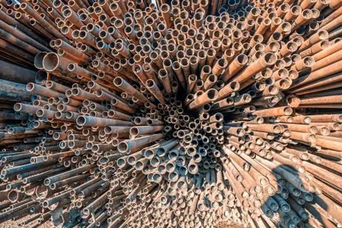 Bunch of rust pipes is made one by one Foto stock