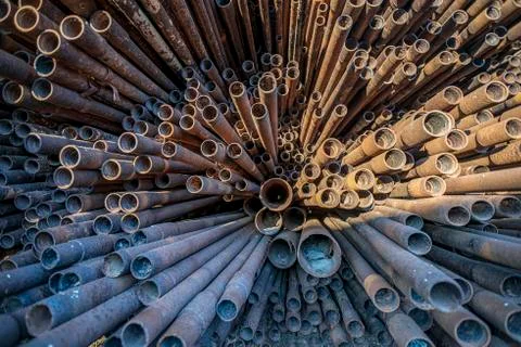 Bunch of rust pipes is made one by one Stock Photos