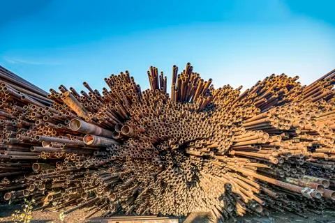Bunch of rust pipes is made one by one Foto stock