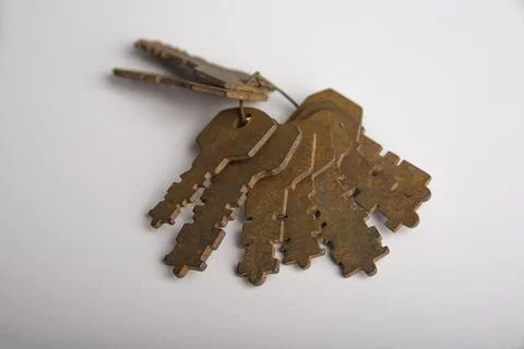 Bunch of rusty padlock keys on a white Stock Photos