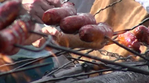 A bunch of sausages on fire - slow motion Stock Footage 67628842