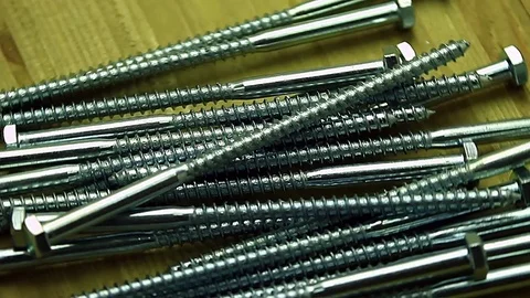 Bunch of screws rotating Stock Footage 74068138