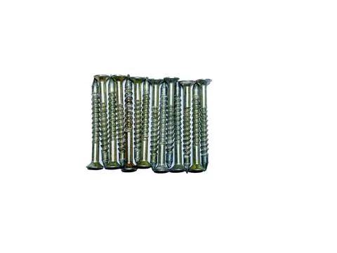 A bunch of self-tapping screws on a white insulated background Stock Photos
