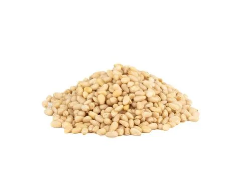 A bunch of shelled pine nuts on a white background. Stock Photos