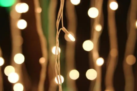 Bunch of small lights hanging on string Stock Photos