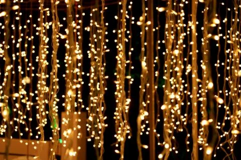 Bunch of small lights hanging on string Stock Photos
