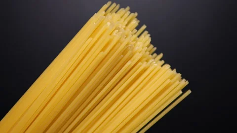 The bunch of spaghetti on black background Stock Footage 133174508