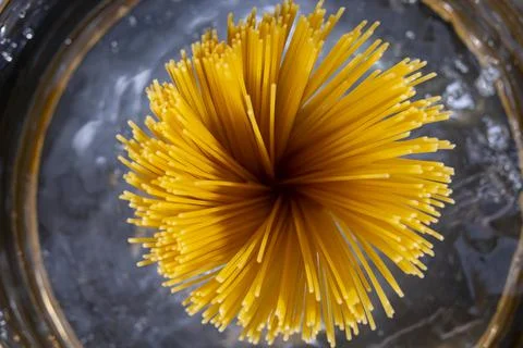 Bunch of spaghetti in boiling water. Stock Photos