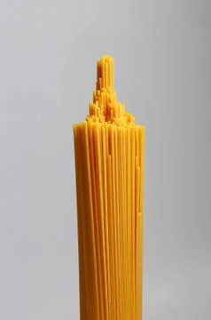 Bunch of spaghetti pasta. Grey background. Close up Stock Photos