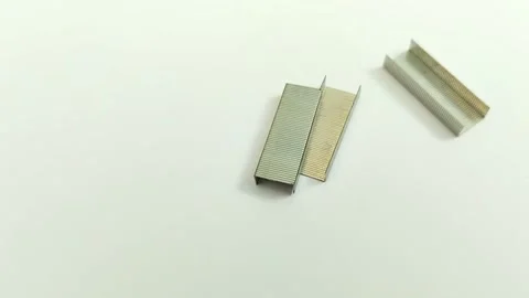 A bunch of staples on a white background Видео 311150411