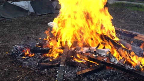 A bunch of stuff burns in fire Stock Footage 106902058