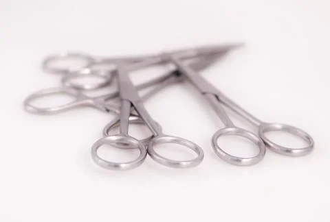 Bunch of surgical scissors on a white background. Stock Photos