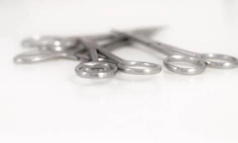 Bunch of surgical scissors on a white background . Foto stock