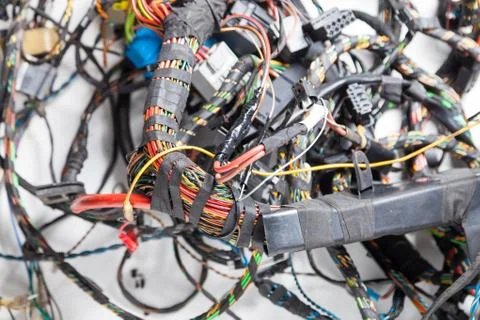 Bunch of tangled wires of different colors, types and sizes with rewound insu Stock Photos