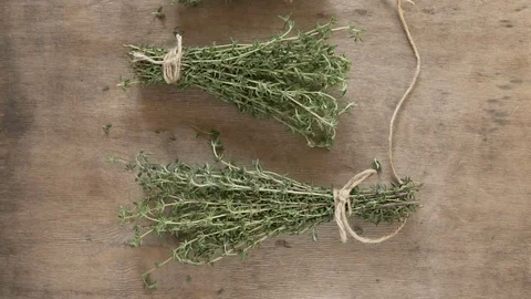 A bunch of thyme on a wooden table. Stock Footage 82634565