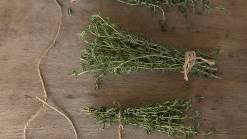 A bunch of thyme on a wooden table. Stock Footage 84387102