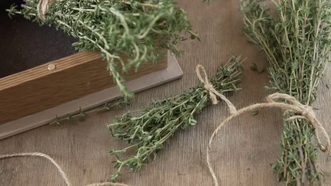 A bunch of thyme on a wooden table. Stock Footage 84961223