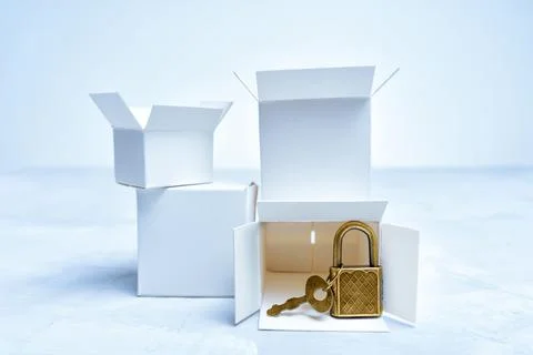 Bunch of tiny boxes and keyed padlock Foto stock