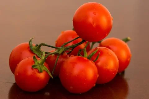 The bunch of tomatoes Stock Photos