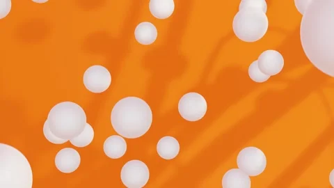 A bunch of white balls on an orange loop animated background Stock Footage 276488570