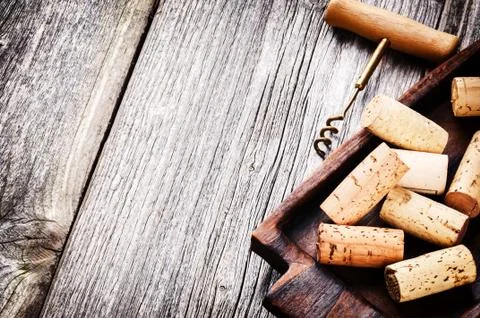 Bunch of wine corks and corkscrew Stock Photos